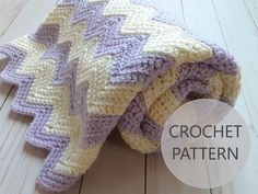 a crocheted blanket laying on top of a wooden floor with the words crochet pattern below it