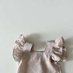 Get ready for summer adventures with our Fly Sleeve Plaid Top & Shorts Set. 🌞 This stylish and casual set is perfect for your little girl's sunny escapades. The sleeveless design keeps her cool, while the square collar adds a touch of elegance. Made from comfortable cotton, this set ensures a perfect fit. The plaid pattern adds a trendy twist, making it a must-have for fashion-forward kids. Are you ready to make a statement? Dress her in this Fly Sleeve Plaid Top & Shorts Set and let her shine! Summer Beach Sets With Ruffles, Sleeveless Ruffled Beach Set, Cute Sleeveless Sets For Vacation, Summer Sets With Ruffles And Sleeveless Design, Playful Cotton Tank Top For The Beach, Summer Tank Top For Playtime, Sleeveless Cotton Sets For Summer, Summer Sleeveless Playwear Sets, Summer Sleeveless Tank Top For Playtime