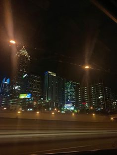 the city is lit up at night with bright lights