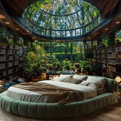 a large bed sitting inside of a bedroom next to a window filled with green plants