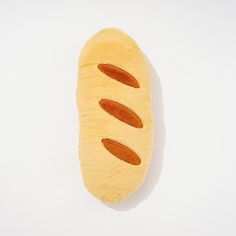 a hot dog bun stuffed animal on a white background