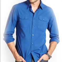 Go From Work To Weekend In This Long Sleeve Button Shirt. Folded Collar And Dual Chest Pockets. Front Button Closures. Signature Logo Patch On Bottom Corner. Color: Blue (More Of A Navy Blue, Color Was Difficult To Capture) 100% Cotton Machine Wash Armpit To Armpit: 19 Inches Across Shoulder To Shoulder: 16.75” Armpit To Cuff: 20.25” Top Shoulder To Bottom Hem 27 Inches Casual Blue Shirt With Buttoned Pockets, Blue Button-up Shirt With Button Cuffs, Casual Blue Shirt With Button Cuffs, Blue Business Casual Shirt With Pockets, Classic Blue Shirt With Roll-up Sleeves, Blue Button-up Shirt With Roll-up Sleeves, Fitted Button-up Shirt With Buttoned Pockets, Blue Button-up Shirt With Placket, Blue Workwear Shirt With Buttoned Pockets