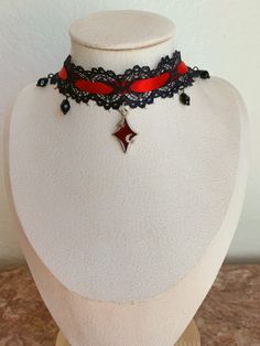 Hand crafted choker perfect for goth / alt / egirl / vampire / vintage styles. Great for events like the Renaissance fair. This choker is made with black lace, red satin ribbon, and a red charm. Ordee now for the perfect accessory for Halloween! Vampire Vtuber, Vampire Drawing, Vampire Vintage, Alt Egirl, White Lace Choker, Red Goth, Diy Choker, Red Choker, Red Gothic