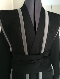 a black and grey kimono is on display