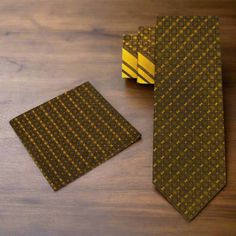 Silk Necktie: Gold Check Texture with Stripe Pattern Introducing our exquisite silk necktie featuring a captivating combination of gold check texture and sleek stripe pattern. Crafted with meticulous attention to detail, this tie is available in a traditional 3.4" width and two lengths—60" regular and 63" extra-long—for the perfect fit. Complete your ensemble with our coordinating dark grey with light gold paisley pocket square or opt for a matching pocket square for a polished look. Dress Shirt Formal Fitted Gold Neckwear, Gold Fitted Neckwear For Formal Occasions, Luxury Gold Tie For Black Tie Events, Gold Tie For Black Tie Events, Classic Gold Suit And Tie Accessories With Pocket Square, Fitted Gold Tie For Semi-formal Occasions, Elegant Gold Ties For Business, Luxury Gold Suit And Tie Accessories For Semi-formal, Elegant Gold Neckwear With Ties