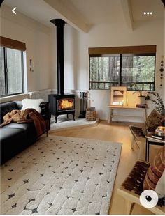 a living room filled with furniture and a fire place