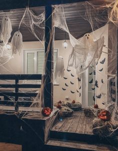 two mirrors with halloween decorations hanging from them