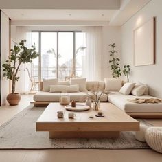 a living room filled with lots of white furniture