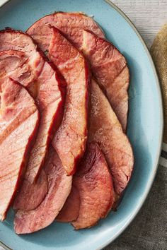 slices of ham on a blue plate