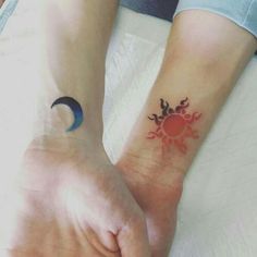 two people with matching tattoos on their wrists