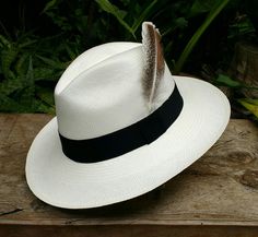 Handmade Customised Panama Hat with Removable Pheasant Feather For a different look to a classic hat. This Pheasant Feather can be add on anytime you like . Included with a Genuine rolling Panama hat. ~ Genuine Panama hat handwoven with Toquilla palm ~ ~ Handwoven in Ecuador~  ~ Ivory White ~ ~ Rolling for easy travel ~ ~ Removable Pheasant  Feather Included ~ Pheasant Feather, Pheasant Feathers, Classic Hats, Easy Travel, Cool Hats, Pheasant, Hat Shop, Ivory White, Hat Sizes