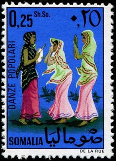 a postage stamp with three women in arabic dress