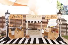 a black and white checkered area with wooden crates