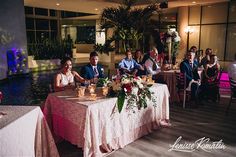 a group of people sitting around a table