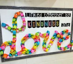 a bulletin board with the word love spelled out in different colors and letters on it