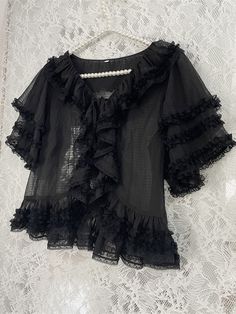 Dress / Top Details:Lace Trim / Ruffle Trim / Self-tie Straps / Semi-sheer Size S L Full Length 46 50 Bust 90 96 Sleeve Length 24 26 Elegant Sheer Short Sleeve Mesh Top, Summer Chiffon Tops With Lace Trim, Black Ruffled Blouse For Daywear, Elegant Chiffon Top With Lace Trim, Semi Sheer Top, Lace Ruffle, Dress Top, Sheer Top, Lolita Fashion