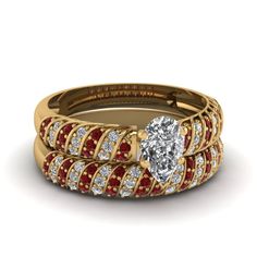 two wedding bands with a heart shaped diamond in the center and red braiding around them