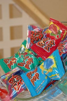 a glass bowl filled with assorted candy