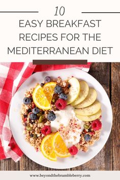 a white plate topped with granola, fruit and yogurt next to sliced oranges