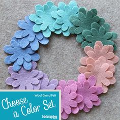 several felt flowers arranged in a circle with the words choose a color set on it