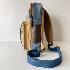 This handmade bag is designed for those who appreciate durability and style. Made with high-quality canvas and denim, it's a canvas backpack built to last through all your travels and daily commutes. Not just for the city streets, it's also ready for the trails as a sturdy hiking backpack. Bag From Old Jeans, Notebook Bag, Convertible Backpack, Convertible Bags, Old Jeans, Jeans Bag, Upcycled Denim, Handmade Bag, Denim Bag