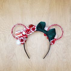 Christmas is just around the corner. These candy cane inspired Minnie Mouse ears are just the thing to put you in the Holiday spirit.  The ears are wrapped in red & white candy with a green velvet bow. The ears are made with heavy duty metal hoops that will not bend keeping your ears perfectly round for your next adventure. The headband is hand wrapped in ribbon making it comfortable for adults and children. All ears are handmade to last, but please handle with care. * Reversible * Headband wrap Xmas Headbands, Disney Mouse Ears, Headband Wrap, Disney Mouse, Handmade Hair Bows, White Candy, Minnie Mouse Ears, Disney Ears, How To Make Ribbon