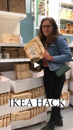 a woman standing in front of stacks of boxes with the caption ikea hack