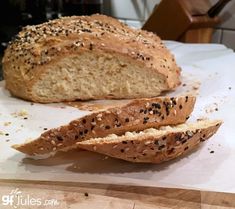 a loaf of bread sitting on top of a cutting board