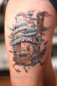 a close up of a tattoo on a person's leg with an image of a ship