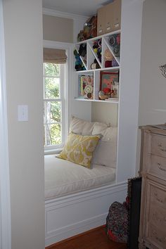 a window seat in the corner of a room