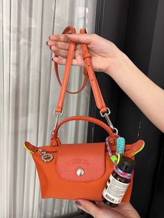 Wearing a white T is very matching with it.This color is really like carrot!! I add a strap for it sothat can be carried on. Longchamp Mini Bag, Longchamp Le Pliage Mini, Longchamp Mini, Wardrobe Wishlist, Winter Closet, Fancy Bags