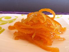 a pile of orange peels sitting on top of a white plate