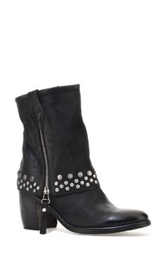 Double-down on contemporary Western styling in this leather boot designed with a dual zip closures and a fold-over-look shaft dotted with studs around the arch-grazing cuff. 3 1/2" heel; 1/2" platform 7 1/4" shaft Dual side-zip closures Leather upper and lining/synthetic sole Imported Leather Punk Moto Boots With Zipper Closure, Fall Rivet Boots For Biker Events, Rugged Moto Boots With Rivets For Fall, Leather Moto Boots With Silver Studs For Fall, Leather Moto Boots With Studs For Winter, Winter Leather Moto Boots With Studs, Leather Moto Boots With Spikes For Winter, Edgy Leather Moto Boots With Zipper Closure, Edgy Leather Moto Boots With Zipper