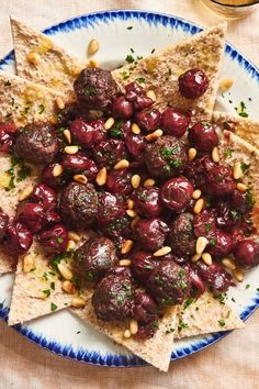 a plate topped with meatballs and tortilla chips