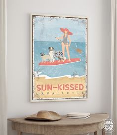 a woman on a surfboard with her dog in the water and sun - kissed lavavallet poster