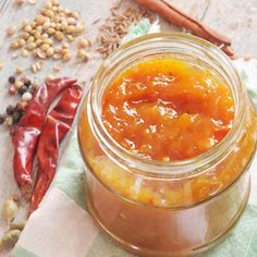 a jar filled with food sitting on top of a table