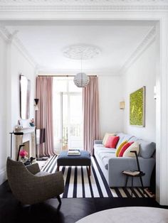 a living room filled with furniture and a fire place