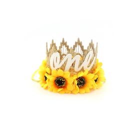 a sunflower crown with the word one written on it and two large yellow flowers