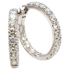 If you are looking for dazzling sparkle from every angle, these stunning diamond hoop earrings will not disappoint! Arranged in a unique inside/outside setting, the diamonds are positioned to catch the light from different angles, making your lobes absolutely glow. These gorgeous hoop earrings feature 6.75 carats total of bright white natural diamonds. There are a total of 32 round brilliant diamonds in the pair, prong set in polished 18 karat white gold. The diamonds are an incredible G-H in co Inside Outside, Diamond Hoop Earrings, Brilliant Diamond, Jewelry Earrings Hoops, Diamond Clarity, Round Brilliant, Prong Setting, Bright White, Ear Piercings