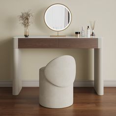 a white chair sitting next to a table with a mirror on it