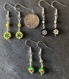 Dinky little handmade earrings, made from hexagon shaped millefiori glass beads, topped with matching millefiori floral beads. These are really pretty earrings, and, as with all of my designs, I never repeat a pair exactly, so you can be sure of a completely unique gift or treat. Perfect for dressing up or down, these earrings are sure to get noticed, due to their quirky design. Sterling silver earwires. Made with love in Kidwelly, Wales. Nickel-free Czech Glass Flower Earrings, Czech Glass Flower Earrings For Gifting, Czech Glass Flower Earrings For Gifts, Czech Glass Flower Earrings With Flower Charm, Yellow Flower Earrings With Colorful Beads For Gift, Colorful Beads Flower-shaped Earrings For Gift, Colorful Beaded Flower-shaped Earrings For Gifts, Colorful Beaded Flower-shaped Earrings As Gift, Flower-shaped Colorful Beaded Earrings