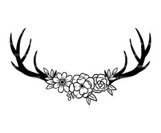 an antler with flowers on it's antlers is shown in black and white