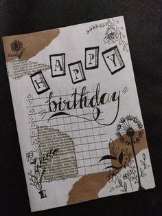 a piece of paper with the words happy birthday written in black and white on it