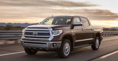 the toyota tundra is driving down the highway