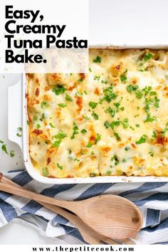 an easy, creamy tuna pasta bake in a white casserole dish with parsley on top