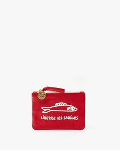 a small red pouch with a fish on it and the words l'herbes les carnives