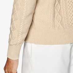 Give any casual look some pronounced pattern and robust texture with this light brown sweater. Comfortably knitted with a bold cross-cable pattern, it features a fine rib along the slightly tapered hem, cuffs, and crewneck collar. Classic Textured Knit Crew Neck Cardigan, Classic Beige Cable Knit Cardigan, Beige Cable Knit Turtleneck Cardigan, Cream Crew Neck Cardigan With Ribbed Cuffs, Beige Cable Knit Crew Neck Sweater, Beige Crew Neck Polo Sweater, Winter Cream Polo Sweater With Ribbed Cuffs, Classic Brown Cable Knit Sweater, Beige Crew Neck Sweater With Ribbed Collar