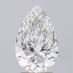 a pear - shaped diamond is shown on top of a white surface with a gray background