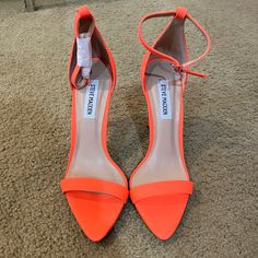 Never Worn About 3in Heel Orange Ankle Strap Heels With 4-inch Heel, Orange Heels With Sculpted Heel For Spring, Orange Open Heel Heels With Sculpted Heel, Orange Ankle Strap Heels With Stacked Heel, Orange Closed Toe Heels With Wrapped Heel, Orange Block Heels With Wrapped Heel, Orange High Heels With Padded Heel, Orange Synthetic Heels With 4-inch Heel, Orange Padded High Heels