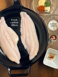 raw fish fillets in a cast iron skillet